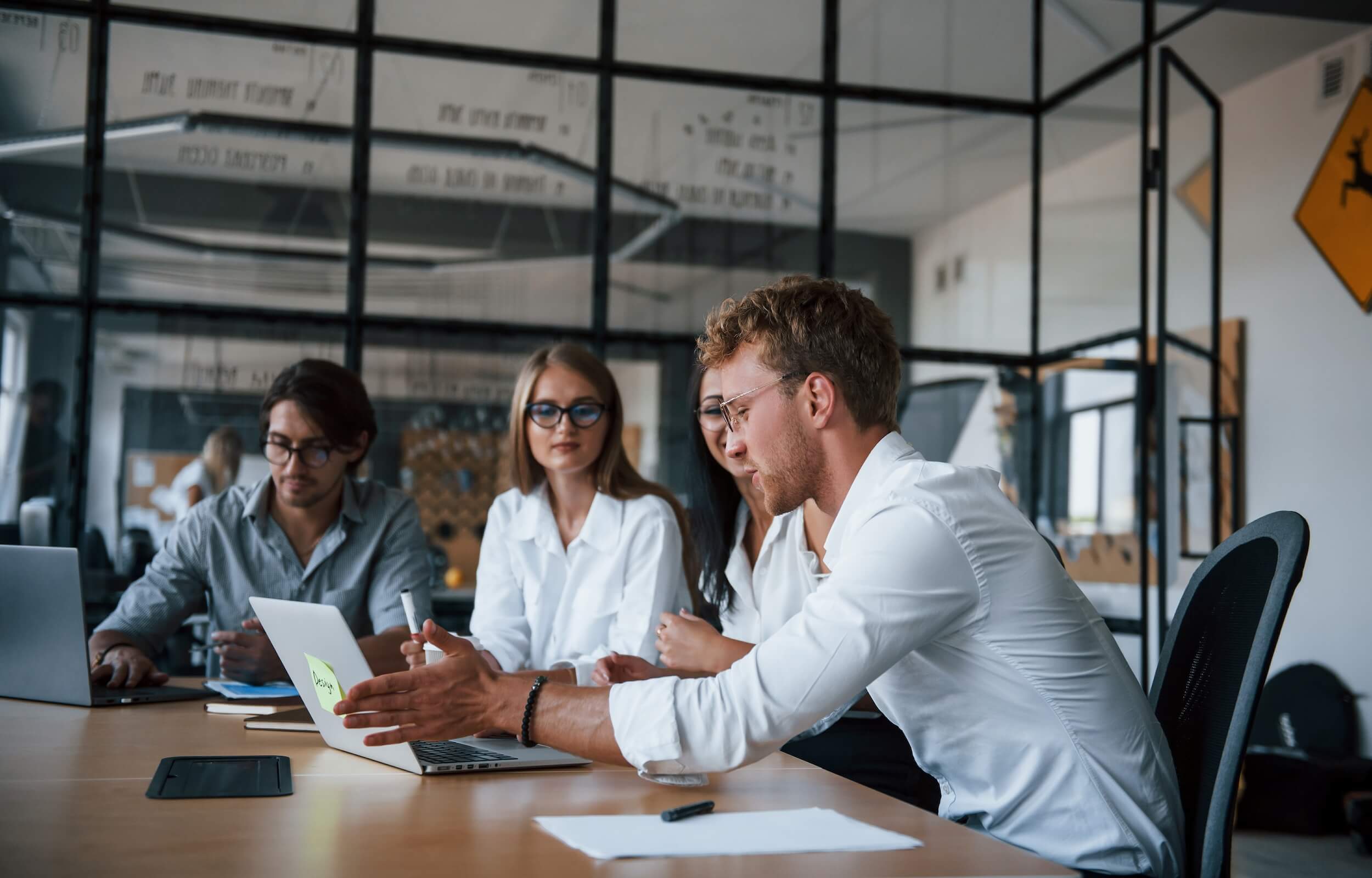 a-meeting-with-three-people-in-a-office