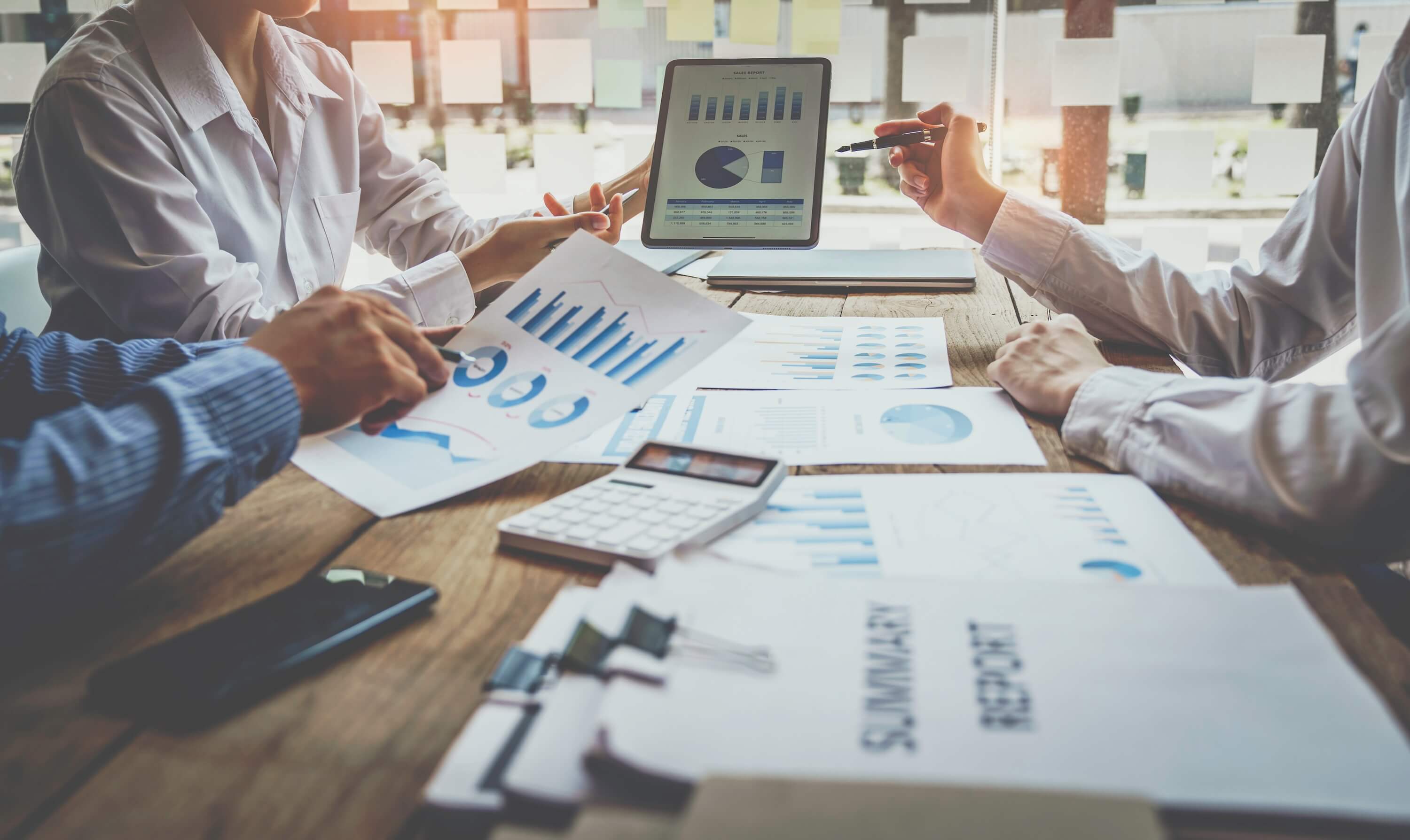 meeting-with-documents-and-graphs-on-a-table